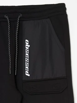 Best Cropp Czarne dresowe joggery z efektem reflective czarny